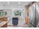 Spacious kitchen boasts an island with granite countertops, stainless steel appliances, and natural light at 3924 Lorien Nw Way, Kennesaw, GA 30152