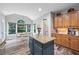 Bright kitchen features an island, granite countertops, stainless appliances, and plenty of natural light at 3924 Lorien Nw Way, Kennesaw, GA 30152