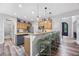 Charming kitchen featuring granite countertops, wood cabinets, stainless appliances, and a stylish island with seating at 3924 Lorien Nw Way, Kennesaw, GA 30152