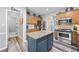 Well-equipped kitchen with granite countertops, stainless steel appliances, and a functional island at 3924 Lorien Nw Way, Kennesaw, GA 30152