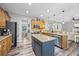 Open kitchen featuring an island with granite countertops, stainless steel appliances, and ample cabinet space at 3924 Lorien Nw Way, Kennesaw, GA 30152