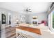 Open concept living room with comfortable sofas, fireplace, ceiling fan, and hardwood floors at 3924 Lorien Nw Way, Kennesaw, GA 30152