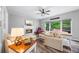 Cozy living room with a fireplace, a comfortable sofa, a ceiling fan, and an outside view at 3924 Lorien Nw Way, Kennesaw, GA 30152