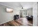 Well-lit living room with wood-look flooring, a TV, and comfortable seating at 3924 Lorien Nw Way, Kennesaw, GA 30152