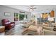 Open-concept living space with modern decor, hardwood floors, and a seamless flow to the kitchen and dining area at 3924 Lorien Nw Way, Kennesaw, GA 30152