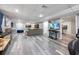 Open finished basement living room featuring gray floors and multiple TVs at 3924 Lorien Nw Way, Kennesaw, GA 30152