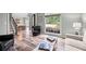 Inviting living room showcases wood-look flooring, large windows, and comfortable seating at 3924 Lorien Nw Way, Kennesaw, GA 30152