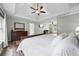 This main bedroom is spacious and features a trey ceiling, wood floors, and lots of natural light at 3924 Lorien Nw Way, Kennesaw, GA 30152