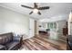 Spacious main bedroom features a ceiling fan, wood floors, and an open floor plan with great natural light at 3924 Lorien Nw Way, Kennesaw, GA 30152