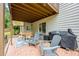 Covered patio featuring outdoor seating, a grill, and a view of the fenced backyard at 3924 Lorien Nw Way, Kennesaw, GA 30152