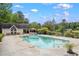 Community pool featuring a gazebo, lounge chairs, and mature trees at 3924 Lorien Nw Way, Kennesaw, GA 30152