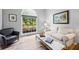 Inviting sitting room with comfortable seating, a view to the outside, and natural light at 3924 Lorien Nw Way, Kennesaw, GA 30152