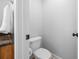 This is a water closet featuring a toilet and a small vanity at 3924 Lorien Nw Way, Kennesaw, GA 30152