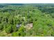 This aerial image shows the house's location in a verdant, established neighborhood at 1301 Eastridge Sw Rd, Atlanta, GA 30311