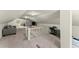 This finished attic features neutral decor, a cozy seating area, and ample storage at 1301 Eastridge Sw Rd, Atlanta, GA 30311