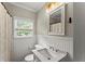 Bathroom with wainscoting, window, and natural light at 1301 Eastridge Sw Rd, Atlanta, GA 30311