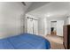 Bright bedroom featuring wood floors, blue comforter and natural light at 1301 Eastridge Sw Rd, Atlanta, GA 30311