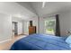 Bedroom with wood floors, windows, and gray walls with white trim at 1301 Eastridge Sw Rd, Atlanta, GA 30311