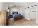 Spacious bedroom features vaulted ceiling, wood floors, barn door to bathroom at 1301 Eastridge Sw Rd, Atlanta, GA 30311