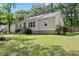 Charming home with lush lawn and landscaped yard offering superb curb appeal and inviting entrance at 1301 Eastridge Sw Rd, Atlanta, GA 30311