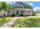 Charming home featuring a well-manicured lawn, complemented by a stone foundation and an inviting entrance at 1301 Eastridge Sw Rd, Atlanta, GA 30311
