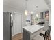 Modern kitchen featuring stainless steel appliances, a stylish island, and ample cabinet space for storage at 1301 Eastridge Sw Rd, Atlanta, GA 30311