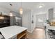 Well-equipped kitchen with quartz countertops, a large refrigerator, and plenty of cabinet space for storage solutions at 1301 Eastridge Sw Rd, Atlanta, GA 30311
