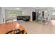 The living area with a breakfast bar seamlessly merges living, dining, and kitchen spaces in an open floor plan at 1301 Eastridge Sw Rd, Atlanta, GA 30311