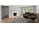 Inviting living room features a fireplace and a neutral palette creating a cozy and welcoming atmosphere at 1301 Eastridge Sw Rd, Atlanta, GA 30311