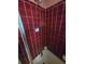 Features in this bathroom include a shower with burgundy tiling and a white shower base at 25 Candler Se Rd, Atlanta, GA 30317
