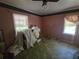 This bedroom has a ceiling fan, neutral colored walls, and windows for natural lighting at 25 Candler Se Rd, Atlanta, GA 30317