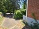 Side of house, showing partial driveway and brick construction at 25 Candler Se Rd, Atlanta, GA 30317