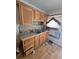 Kitchen featuring wood cabinets, laminate countertops and a stainless-steel sink at 25 Candler Se Rd, Atlanta, GA 30317