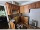 Kitchen with outdated cabinets and showing signs of repair needed at 25 Candler Se Rd, Atlanta, GA 30317
