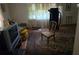 Living Room area showing a dated TV and antique rug at 25 Candler Se Rd, Atlanta, GA 30317