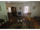 Living Room area showing a dated TV and antique rug at 25 Candler Se Rd, Atlanta, GA 30317