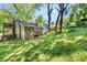 Enjoy a spacious green backyard with mature trees providing ample shade to this house at 2923 Akron St, East Point, GA 30344