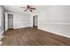 Bright bedroom with wood-look floors, fresh gray paint, and closet for ample storage at 2923 Akron St, East Point, GA 30344