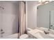 Neutral bathroom with a shower-tub combination, light walls, vanity with sink and a towel bar at 7820 Bristol Valley Dr, Cumming, GA 30028