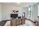 Well-lit office featuring a spacious desk, neutral decor, and a view to the outdoors, promoting productivity at 7820 Bristol Valley Dr, Cumming, GA 30028