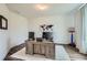 Bright office space with a large desk, modern decor, and wood-look flooring for a professional feel at 7820 Bristol Valley Dr, Cumming, GA 30028