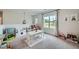 Spacious playroom with a play kitchen, table, and large window at 7820 Bristol Valley Dr, Cumming, GA 30028
