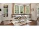 Bright breakfast nook featuring custom banquette seating and a stylish table at 927 Berkshire Ne Rd, Atlanta, GA 30324