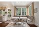 Sun-filled breakfast nook with banquette seating and views of the backyard at 927 Berkshire Ne Rd, Atlanta, GA 30324
