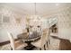 Bright dining room with a chandelier, patterned wallpaper, and seating for six at 927 Berkshire Ne Rd, Atlanta, GA 30324