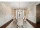 Elegant dining room with a chandelier, patterned wallpaper, and seating for six at 927 Berkshire Ne Rd, Atlanta, GA 30324