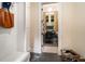 Welcoming entryway featuring stone floors, a storage bench, and a view into a well-lit, functional office space at 927 Berkshire Ne Rd, Atlanta, GA 30324