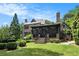 Beautiful brick home with a screened-in porch overlooking a well-manicured lawn and lush greenery at 927 Berkshire Ne Rd, Atlanta, GA 30324