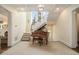 Grand foyer with a piano, staircase, and coffered ceiling at 927 Berkshire Ne Rd, Atlanta, GA 30324