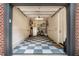 One car garage with checkerboard flooring, ample storage, and space for bikes at 927 Berkshire Ne Rd, Atlanta, GA 30324